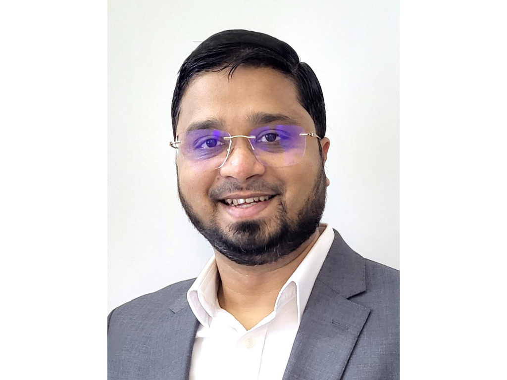 Headshot of Shadab Taiyabi, who is smiling against a white background